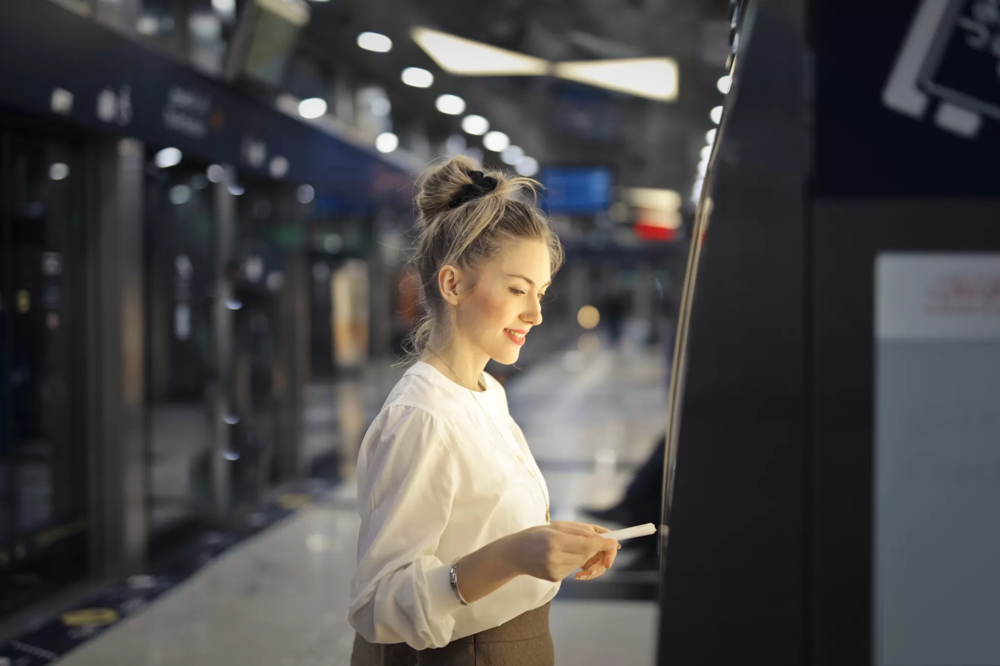 woman buys ticket subway 2048x1365 1